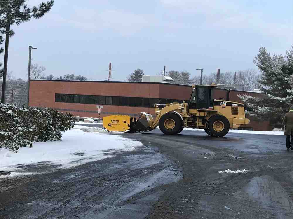 Snow removal equipment in action - best commercial sidewalk snow removal equipment