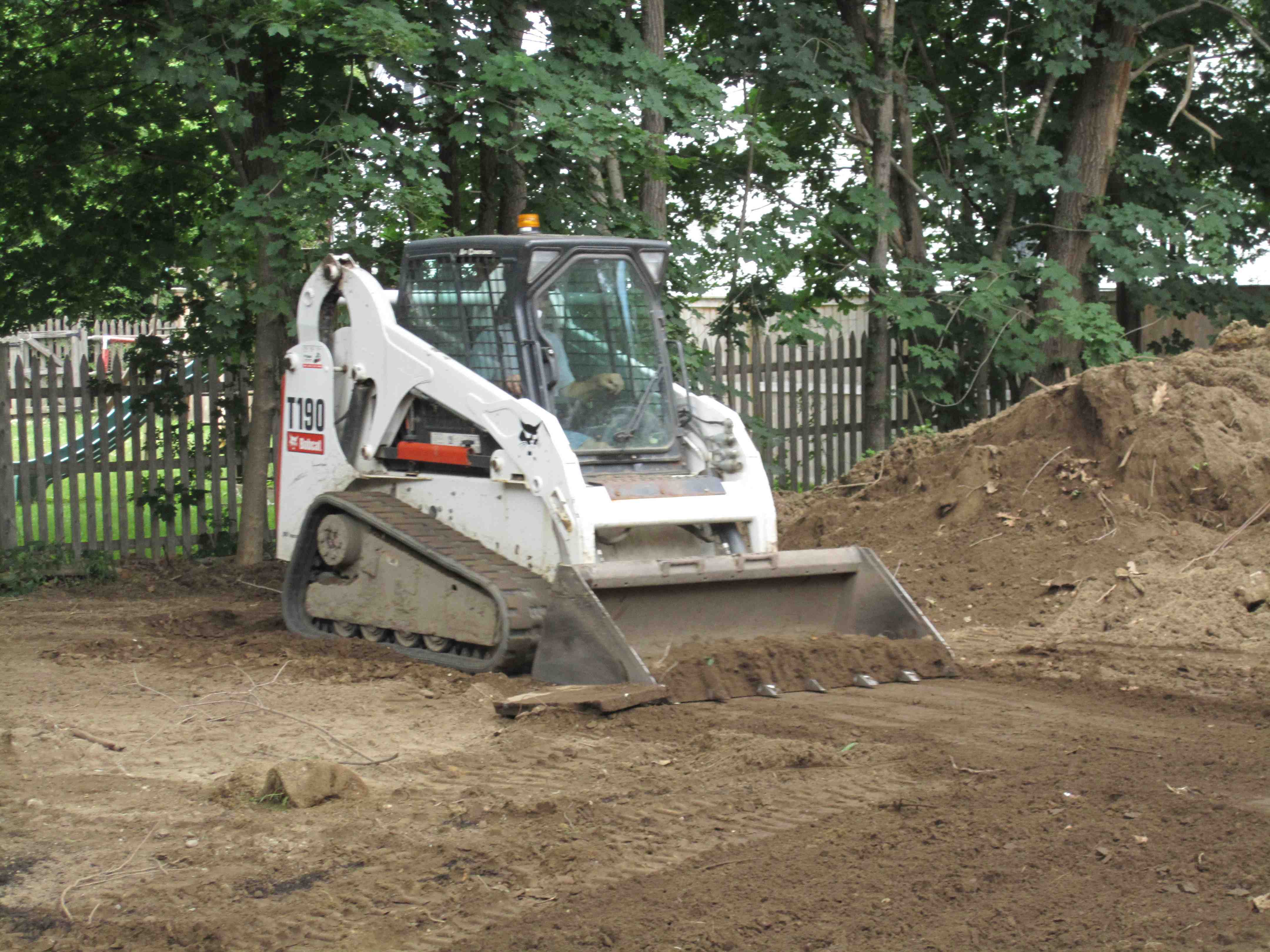 Site excavation for patio installation showing proper depth and preparation - Patio Installation Service